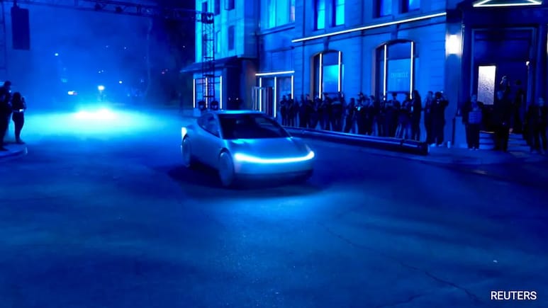 Elon Musk's Tesla Promises Paid Robotaxis Next Year