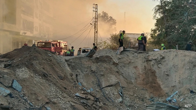 Lebanon Rescuer Picks Up "Pieces" Of Father After Israel Strike